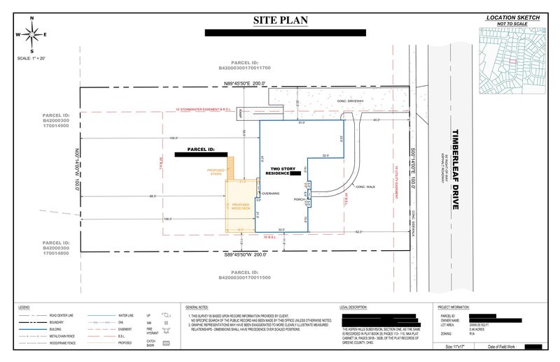 Sample deck site plan showing a proposed wood deck and stairs between a 15 foot stormwater easement and a 10 foot utility easement, owner details redacted