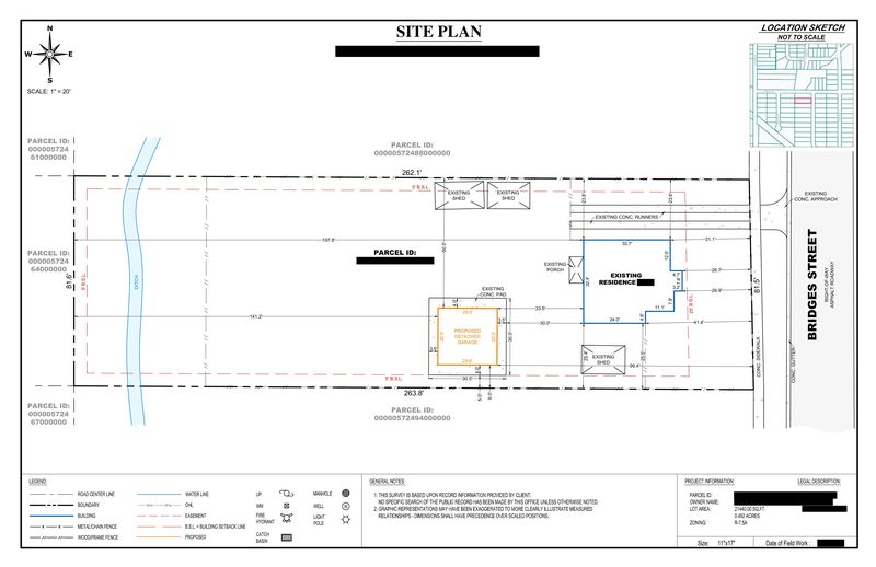 Sample site plan showing a proposed detached garage with setback dimensions, three existing sheds and a drainage ditch, owner details redacted